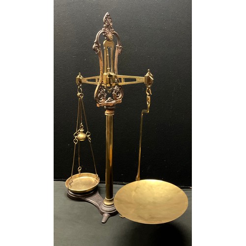 460 - A set of Victorian brass and cast iron shop balance scales, 'To Weigh 7LB', W & T Avery, Birmingham,... 