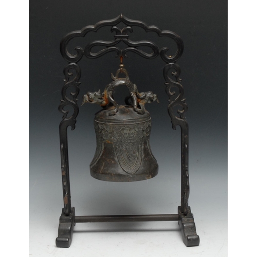 67 - A Chinese bronze bell or gong, cast in the typical Archaic taste with dragons, lappets and taotie, 2... 