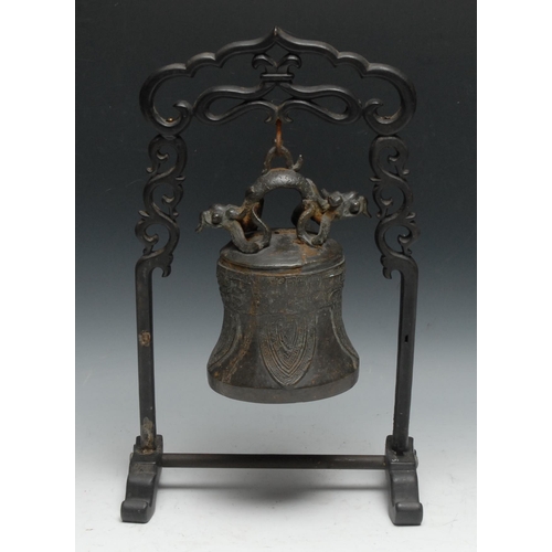 67 - A Chinese bronze bell or gong, cast in the typical Archaic taste with dragons, lappets and taotie, 2... 