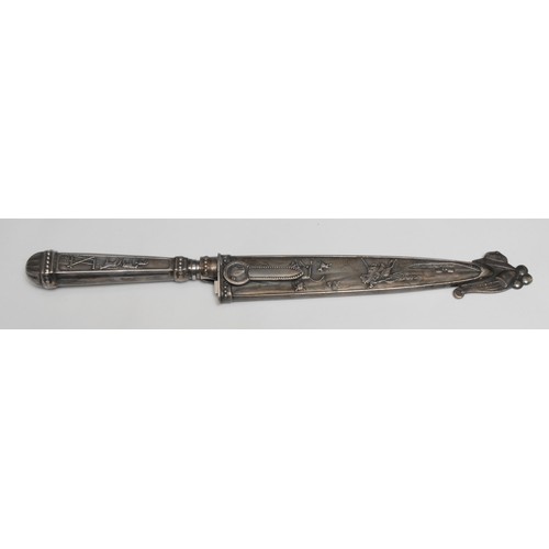 741 - A South American silvered metal gaucho knife, the hilt and sheath in relief with cattle, horses and ... 