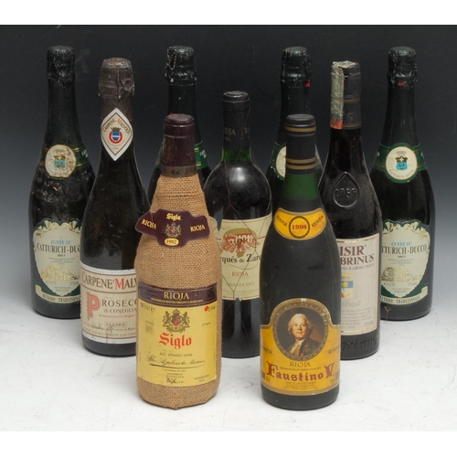 803 - A bottle of Catturich-Ducco Brut, 115, 75cl, three others the same; a bootle of Rioja Faustino V, Re... 