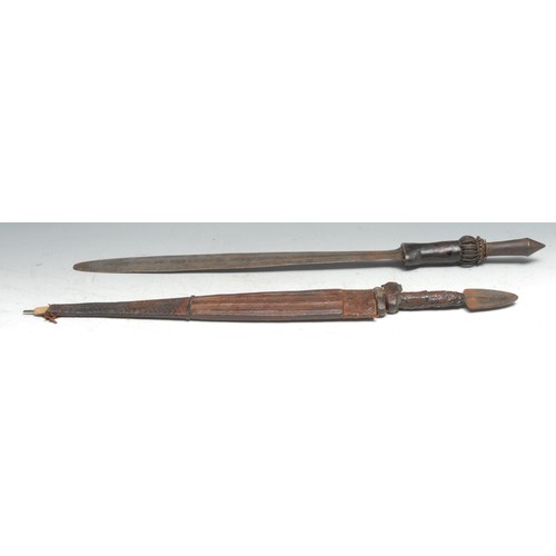 724 - Tribal Art - a West African sword, 44cm blade, the copper and iron hilt with leather grip, 64cm long... 