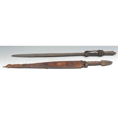 724 - Tribal Art - a West African sword, 44cm blade, the copper and iron hilt with leather grip, 64cm long... 