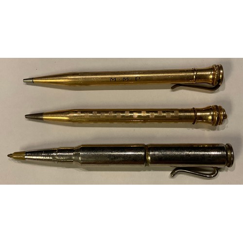 286 - A 'trench art' pen, constructed from rifle shells; two gold plated pencils (3)