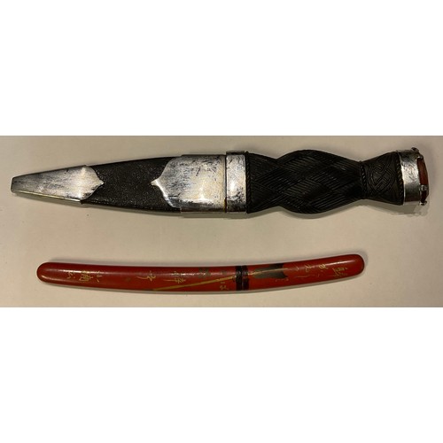 289 - A miniature Japanese Samurai sword, lacquered sheath; a Scottish Dirk (2)