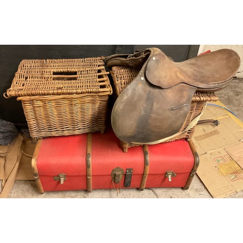 307 - An Overpond trunk, 92cm wide, 51cm wide;  two wicker hampers;  a saddle