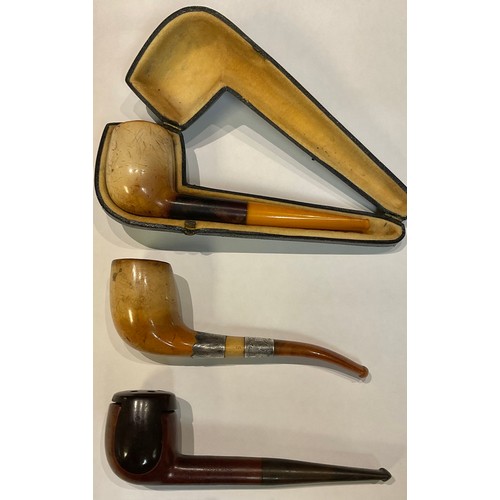 354 - A silver mounted meerschaum type pipe; another, cased; a Roy Tallent Hurricane Deluxe pipe (3)