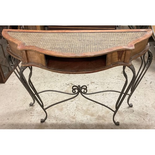 326 - A serpentine fronted conservatory table, leafy metal legs, 110cm wide, 82cm high