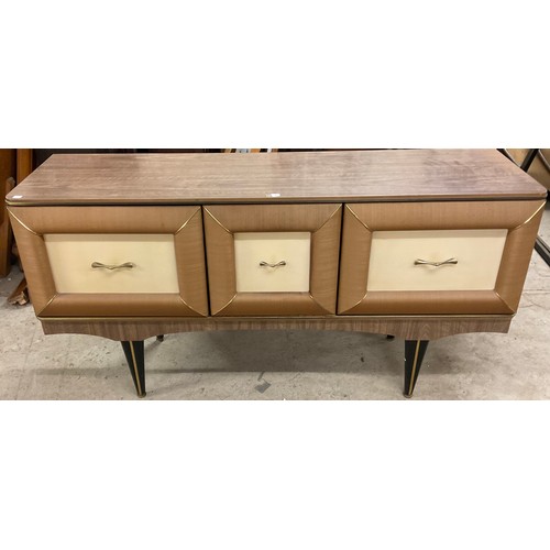 332 - A retro mid-20th century sideboard, rectangular top above a central fall front door enclosing a drin... 