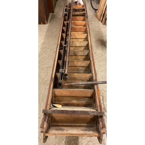 333 - A mid 20th century loft ladder, 324cm long