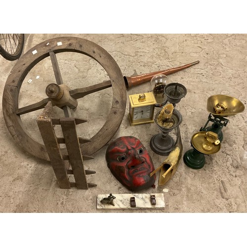 340 - A pair of picket candlestick;   an old wheel;   scales and weights;  clocks;  etc