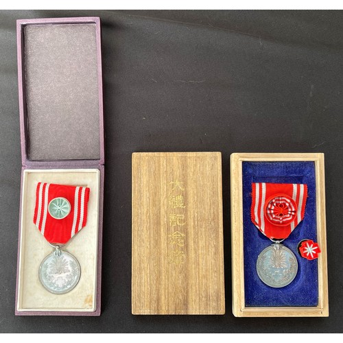 3033 - Pair of cased Japanese Red Cross Medals. (2)