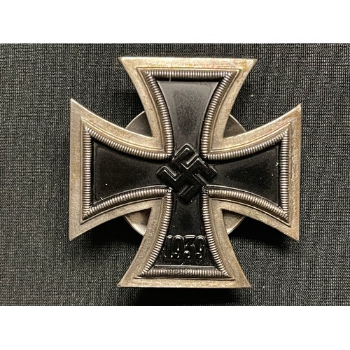 3055 - Reproduction WW2 Third Reich Iron Cross 1st class. One piece construction. Screwback with maker mark... 