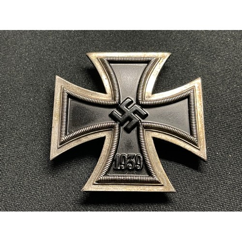 3055 - Reproduction WW2 Third Reich Iron Cross 1st class. One piece construction. Screwback with maker mark... 