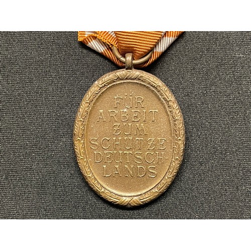 3068 - WW2 Third Reich Deutsches Schutzwall-Ehrenzeichen - West Wall Medal. Early issue example in Tombak a... 