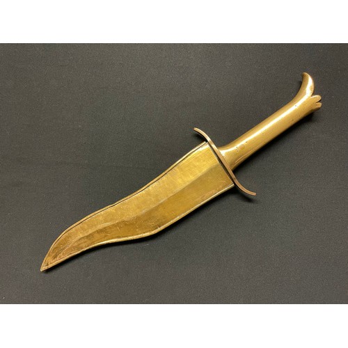 3094 - An Indian dagger, 22.5cm broad wavy blade double-edged blade, brass hilt with stylised lotus pommel,... 