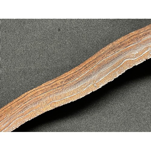 3095 - An Indonesian kris, 32cm wavy blade with pronounced pamor, hardwood hulu carved as a stylised lotus,... 