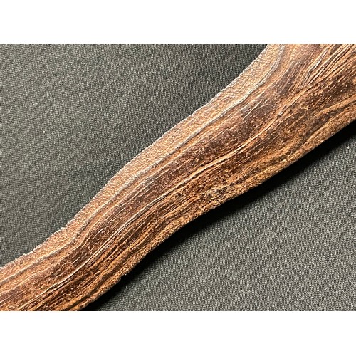 3095 - An Indonesian kris, 32cm wavy blade with pronounced pamor, hardwood hulu carved as a stylised lotus,... 