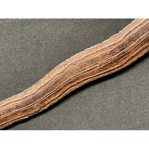 3095 - An Indonesian kris, 32cm wavy blade with pronounced pamor, hardwood hulu carved as a stylised lotus,... 