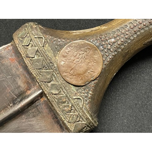 3106 - A Middle Eastern jambiya, 18.5cm curved blade with central ridge, horn handle, embellished scabbard,... 