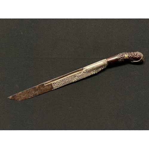 3109 - A Sinhalese Piha kaetta dagger, 15cm blade damascene in silver and koftgari, horn handle carved with... 