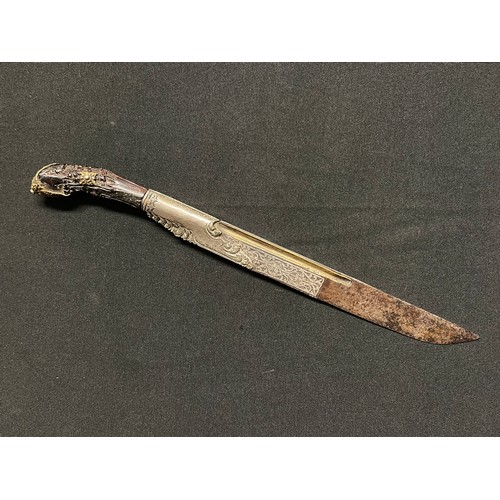 3109 - A Sinhalese Piha kaetta dagger, 15cm blade damascene in silver and koftgari, horn handle carved with... 