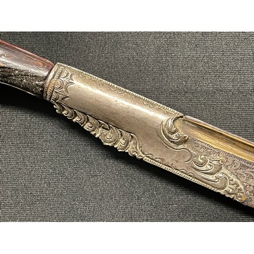 3109 - A Sinhalese Piha kaetta dagger, 15cm blade damascene in silver and koftgari, horn handle carved with... 