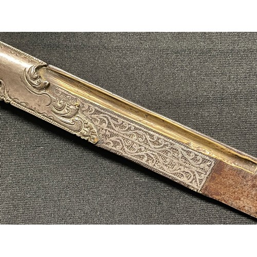 3109 - A Sinhalese Piha kaetta dagger, 15cm blade damascene in silver and koftgari, horn handle carved with... 