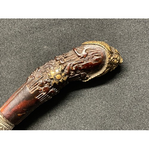 3109 - A Sinhalese Piha kaetta dagger, 15cm blade damascene in silver and koftgari, horn handle carved with... 