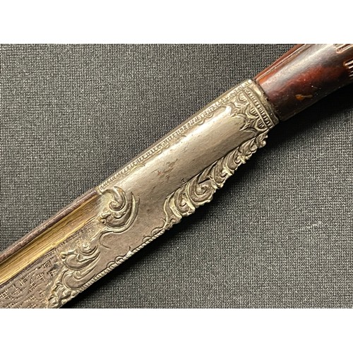 3109 - A Sinhalese Piha kaetta dagger, 15cm blade damascene in silver and koftgari, horn handle carved with... 