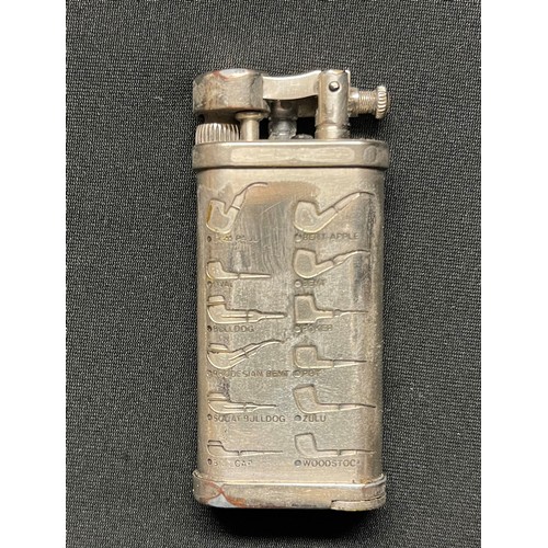 462 - A pipe lighter, engraved with various pipe profiles, removeable tamping tool, with pouch, Corona, Ja... 