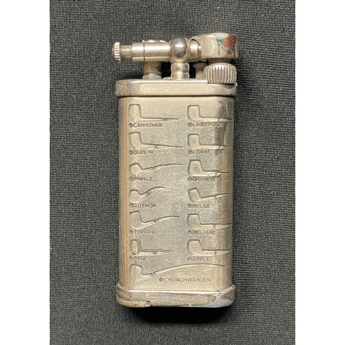 462 - A pipe lighter, engraved with various pipe profiles, removeable tamping tool, with pouch, Corona, Ja... 