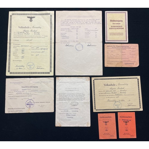 3312 - WW2 Third Reich documents to Aloysius Hermann Hombach. School certificates, vacination certificate, ... 