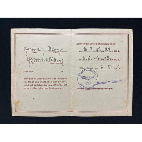 3312 - WW2 Third Reich documents to Aloysius Hermann Hombach. School certificates, vacination certificate, ... 