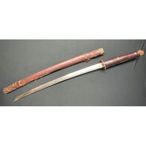 3325 - WW2 Japanese Katana . 700mm long single edged blade. Overall length 950mm. Grip has a leather cover.... 