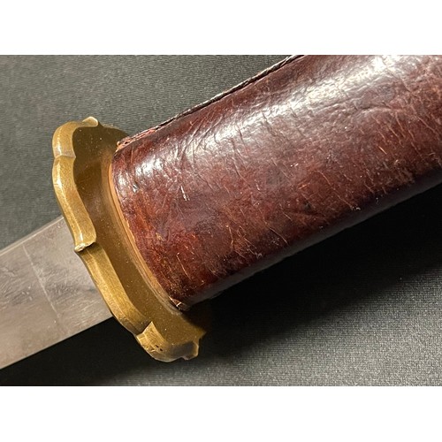 3325 - WW2 Japanese Katana . 700mm long single edged blade. Overall length 950mm. Grip has a leather cover.... 