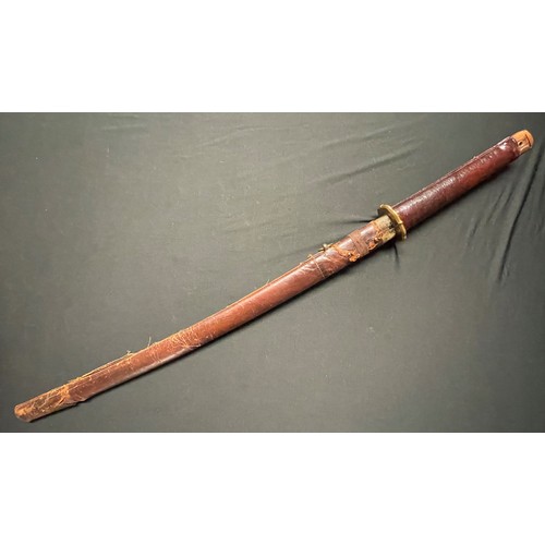 3325 - WW2 Japanese Katana . 700mm long single edged blade. Overall length 950mm. Grip has a leather cover.... 