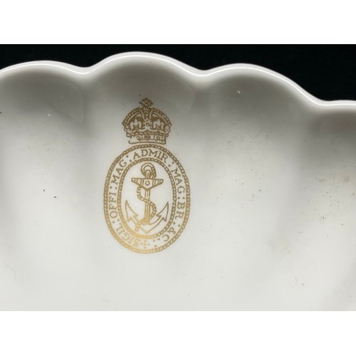 3349 - A porcelain comport and a dinner plate, transfer-printed in gold with the Admiralty seal device surm... 