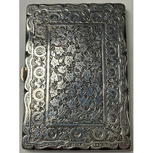 529 - A Victorian silver rounded rectangular visiting card case, engraved with trailing ivy and roundels, ... 