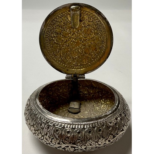 543 - An Anglo-Indian circular pot and cover, hinged cover, chased and engraved with foliate scrolls, 8cm ... 