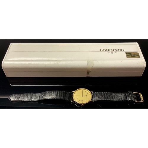 568 - A gentleman's Longines gold plated watch, gilt metal dial, baton indicators, centre seconds, date ap... 