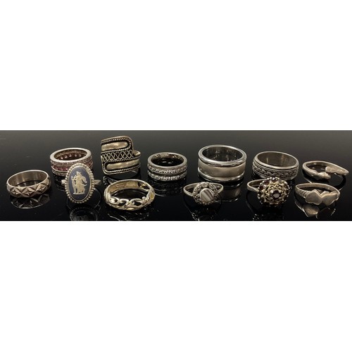 592 - A collection of silver and silver coloured metal rings, mostly marked (12)