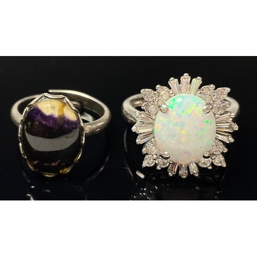 594 - A silver and Blue John set ring, marked Sterling; a silver and opal ring, marked 925 (2)