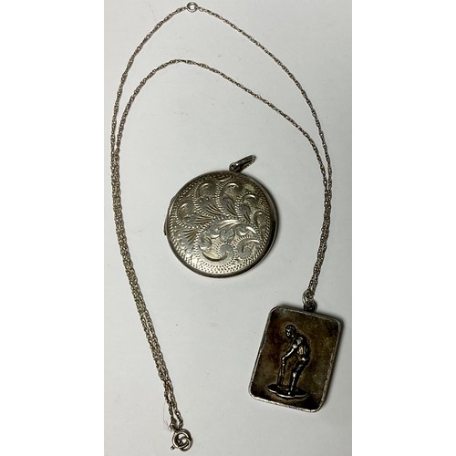 600 - Jewellery - cricket interest - a 19th century silver locket and chain, the locket with cricketer, ha... 