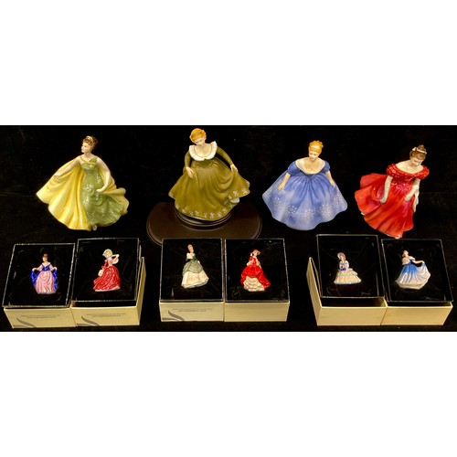 70A - A Royal Doulton figure Winsome HN2220; three others, Alexandra HN2398, Nina HN2347, Geraldine HN2348... 