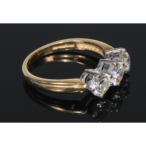 636 - **Collected 30/11/22 CC**An 18ct gold diamond ring, the three brilliant cut claw set stones approx. ... 