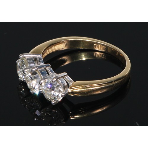 636 - **Collected 30/11/22 CC**An 18ct gold diamond ring, the three brilliant cut claw set stones approx. ... 