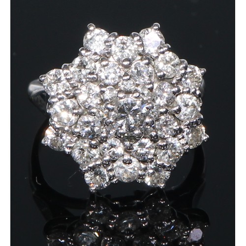 643 - An 18ct gold diamond cluster ring, size M, 8.2g