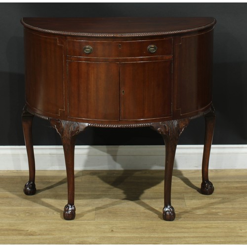 205 - A George III Revival mahogany demilune side cabinet, 79cm high, 85cm wide, 44cm deep, c.1920