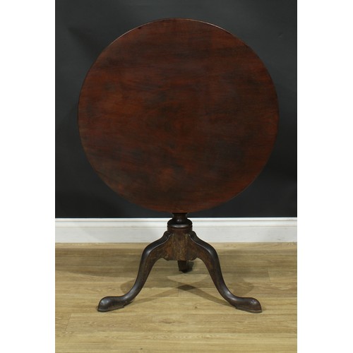 207 - A George III mahogany tripod occasional table, circular one-piece tilting top, turned column, cabrio... 